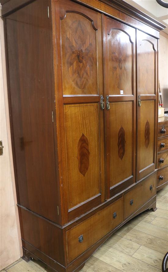 A 1920s inlaid mahogany triple wardrobe, H.211cm